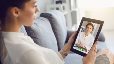A woman talking to a provider on a video call