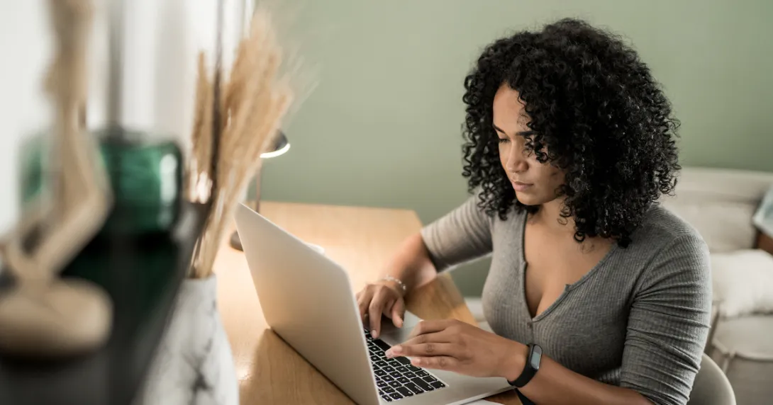 
  Person sitting down and looking at a computer
