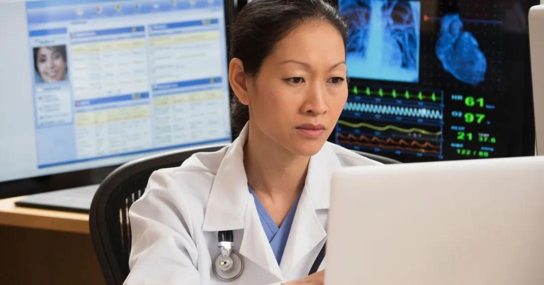 
  Healthcare provider sitting at a computer
