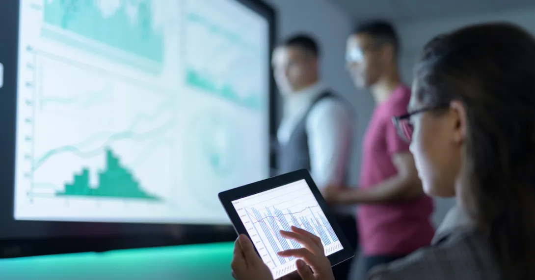 
  A group of researchers analysing graphs
