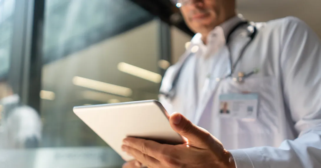 Healthcare provider looking at a tablet